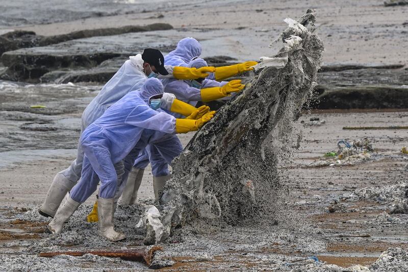 Debris from the 'MV X-Press Pearl' being cleared from a beach near Colombo. AFP