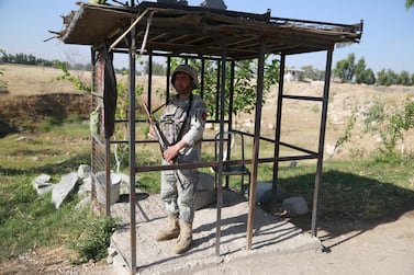 An Afghan security official stands guard on a roadside check point as the Taliban declared a three-day ceasefire during Eid Al Fitr, which marks the end of Ramadan. EPA