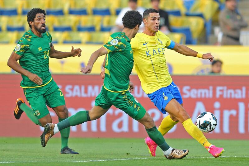 AL Nassr's Portuguese forward Cristiano Ronaldo battles for the ball. AFP