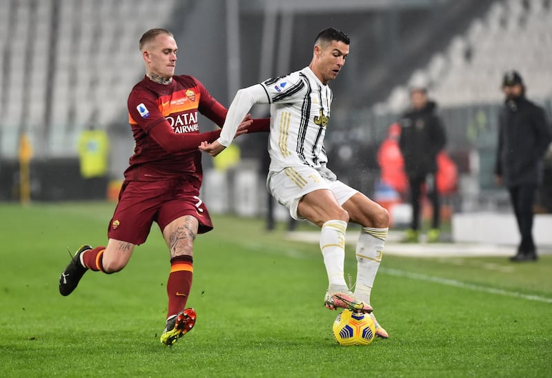 Cristiano Ronaldo under pressure from Roma's Rick Karsdorp. Reuters