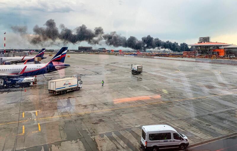 Smoke billows out across the airport. AFP.