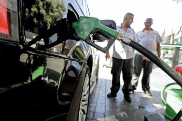 A driver fills his tank at a petrol station in the Lebanese capital Beirut. Fuel retailers have closed twice already to protests against dollar shortages. AFP