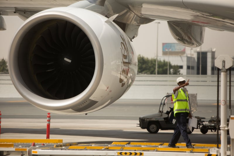 A ground staff worker signals a plane is clear. The new visa roll out is expected to draw more visitors with Dubai gearing up for an influx of visitors over the winter.