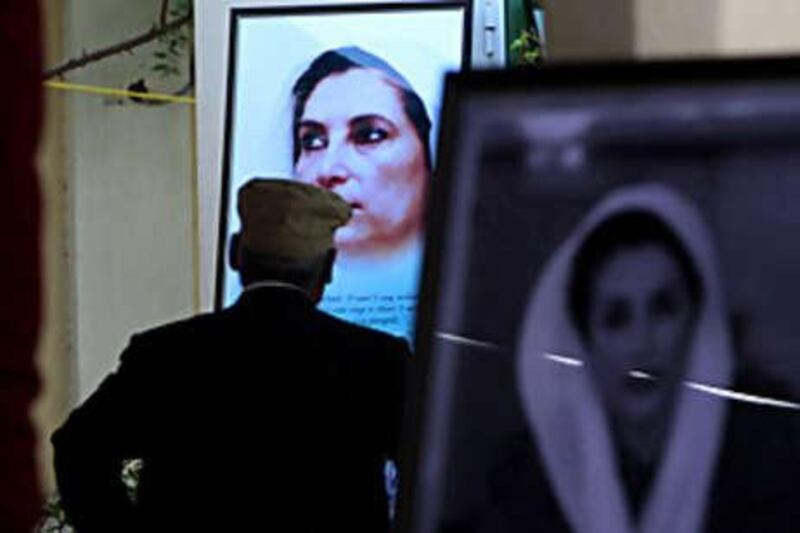 A man gazes at a picture of Benazir Bhutto during a memorial yesterday at the house in Dubai where she spent nine years in exile from Pakistan.