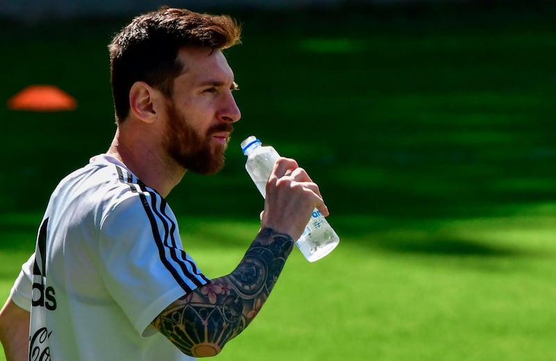 Argentina's Lionel Messi has some water during a training session in Belo Horizonte, state of Minas Gerais, Brazil, on June 18, 2019, on the eve of their Copa America football match against Paraguay. AFP