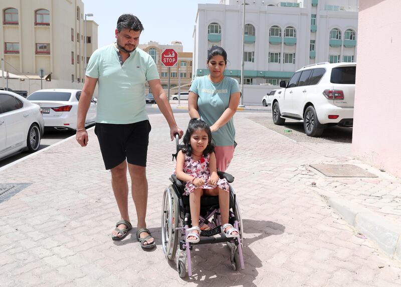 Rahul Pathak and Ashtha Muthoo want to see their daughter Arya, 6, cured from Spinal Muscular Atrophy. They hope to see her walk, eat, breathe and live a life without difficulties. Khushnum Bhandari/ The National