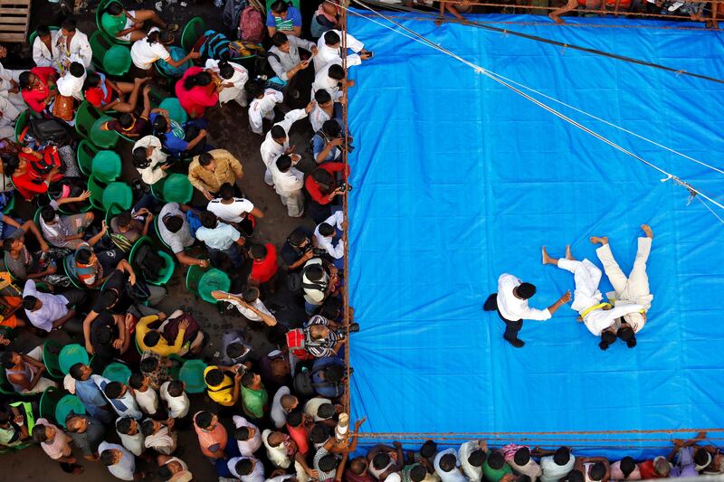 Women wrestlers fight during an amateur wrestling match as part of Diwali, the festival of lights, celebrations in Kolkata, India. Rupak De Chowdhuri / Reuters