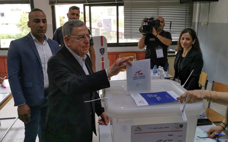Former Lebanese prime minister Fouad Siniora casts his vote at a polling station during the parliamentary election, in Sidon, southern Lebanon. Reuters