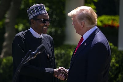 U.S. President Donald Trump, right, shakes hands with Muhammadu Buhari, Nigeria's president, during a news conference in the Rose Garden of the White House in Washington, D.C., U.S., on Monday, April 30, 2018. Trump said today he and Buhari are working on a big deal on military equipment, including helicopters and the two will discuss the fight against terrorism, including Boko Haram and the Islamic State. Photographer: Al Drago/Bloomberg