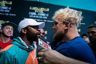 Floyd Mayweather (L) and Jake Paul pose during a press conference at Hard Rock Stadium, in Miami Gardens, Florida, on May 6, 2021. Former world welterweight king Floyd Mayweather said May 4,2021 he will face off against YouTube personality Logan Paul in an exhibition bout at Miami's Hard Rock Stadium on June 6, 2021. / AFP / Eva Marie UZCATEGUI