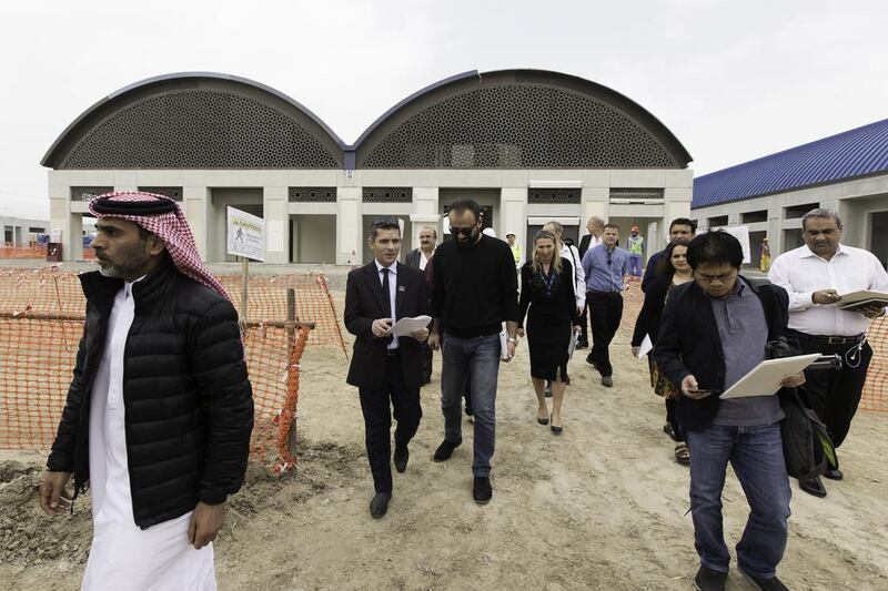 Journalists and dignitaries tour the night market on Nakheel's Deira Islands project in Dubai. Christopher Pike / The National