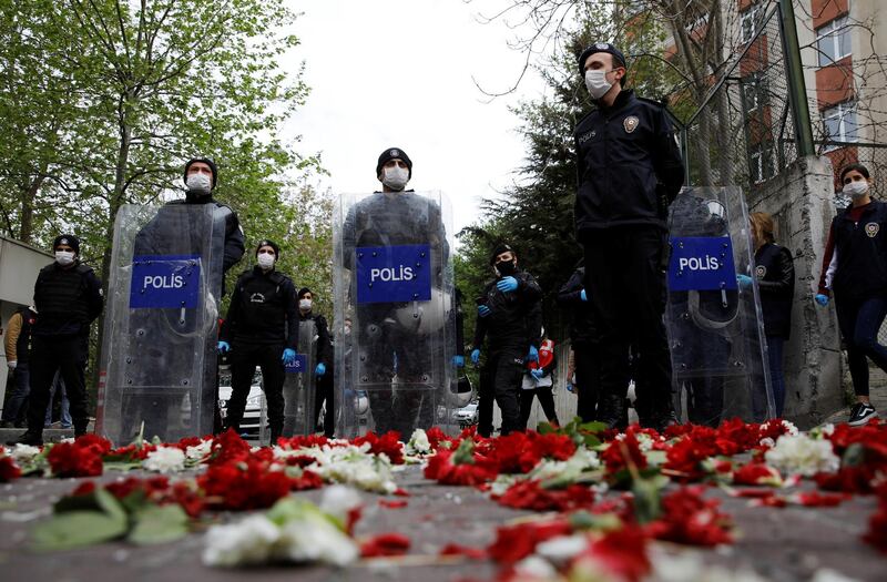 Carnations are seen spread on the ground in front of Turkish police officers as trade union leaders attempt to defy a ban and march on Taksim Square to celebrate May Day, during a three-day curfew in Istanbul, Turkey. Reuters