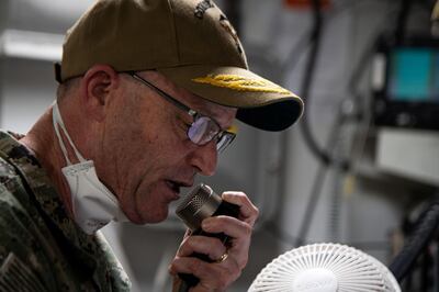 Vice Admiral William Merz, commander, U.S. 7th Fleet, speaks to U.S. Navy sailors assigned to the aircraft carrier during a coronavirus disease (COVID-19) outbreak on the ship at Naval Base Guam April 7, 2020. Picture taken April 7, 2020. U.S. Navy/Mass Communication Specialist Seaman Kaylianna Genier/Handout via REUTERS.  THIS IMAGE HAS BEEN SUPPLIED BY A THIRD PARTY.