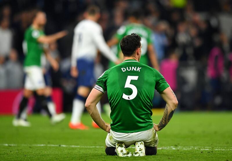 Brighton's Lewis Dunk looks dejected after Christian Eriksen's goal. Reuters