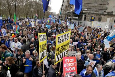 Thousands of demonstrators crowd the streets during a Peoples Vote anti-Brexit march in London, Saturday, March 23, 2019. The march, organized by the People's Vote campaign is calling for a final vote on any proposed Brexit deal. This week the EU has granted Britain's Prime Minister Theresa May a delay to the Brexit process. (AP Photo/Tim Ireland)