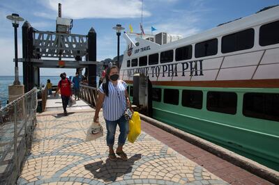 Passengers disembark from a ferry at Phi Phi island in Thailand.  AFP