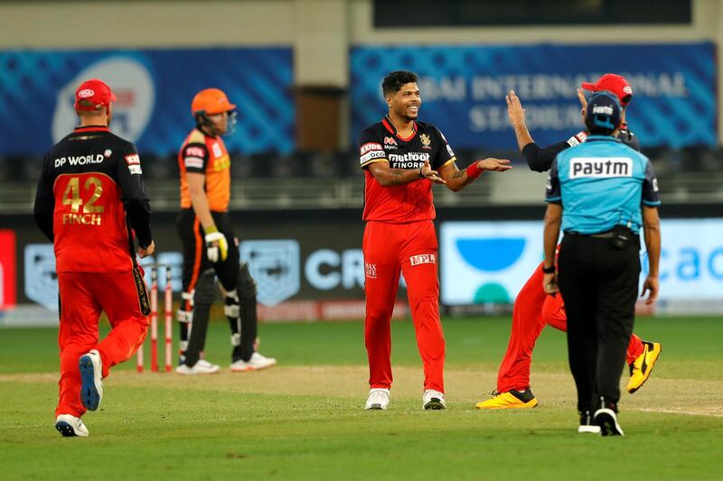 The Royal Challengers Bangalore  team celebrates the wicket of  David Warner of Sunrisers Hyderabad during match 3 of season 13 Dream 11 Indian Premier League (IPL) between Sunrisers Hyderabad and Royal Challengers Bangalore held at the Dubai International Cricket Stadium, Dubai in the United Arab Emirates on the 21st September 2020.  Photo by: Saikat Das  / Sportzpics for BCCI