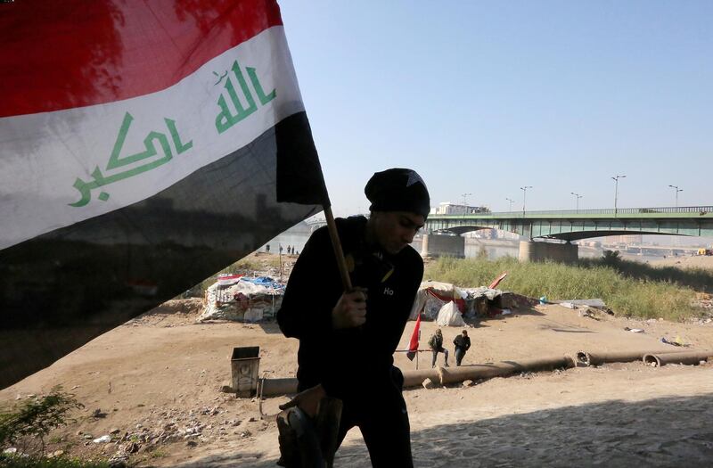 An Iraqi protestor leaves a camp site next to al-Jumhuriyah (Republic) Bridge spanning the River Tigris. AFP