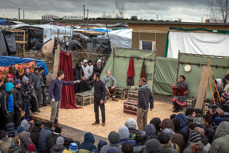 Actors from Shakespeare's Globe perform Hamlet to migrants at the Good Chance Theatre Tent in the camp in February 2016