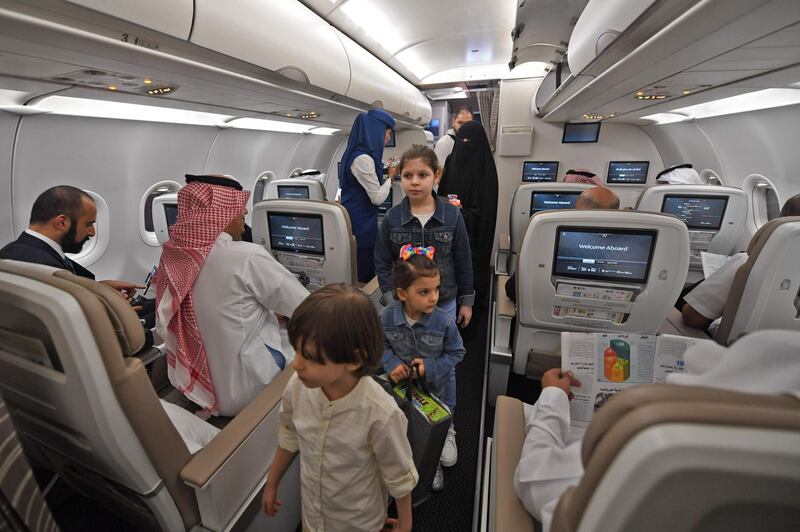 Passengers on the first Saudi Airlines direct flight from Jeddah to the Iraqi city of Erbil, visit the aircraft during their trip. AFP