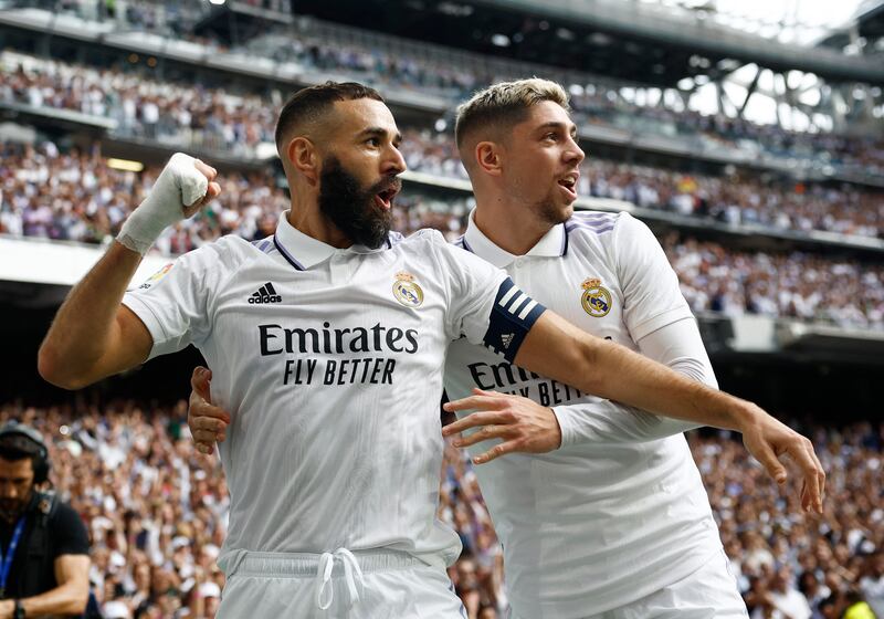 Karim Benzema celebrates with Federico Valverde after scoring the first goal in Real Madrid's 3-1 clasico win against Barcelona at the Santiago Bernabeu on October 16, 2022. Reuters