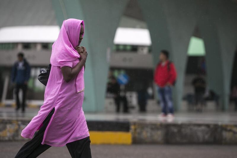 Abu Dhabi residents woke up to a gloomy and rainy weather on Wednesday morning, March 26 2014. Silvia Razgova / The National