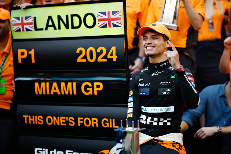 Lando Norris celebrates victory with his McLaren team after the Miami Grand Prix. AFP