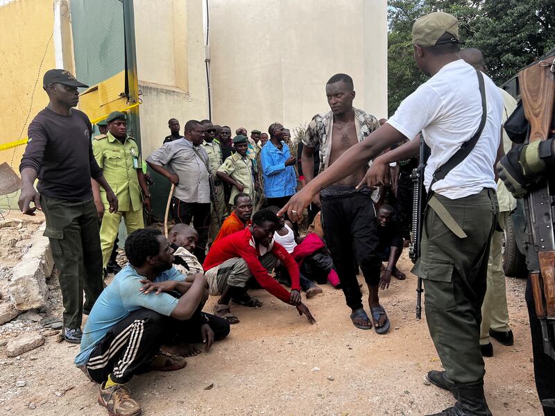 Inmates who escaped during the attack by suspected Boko Haram fighters wait after being captured and returned to the prison. Reuters