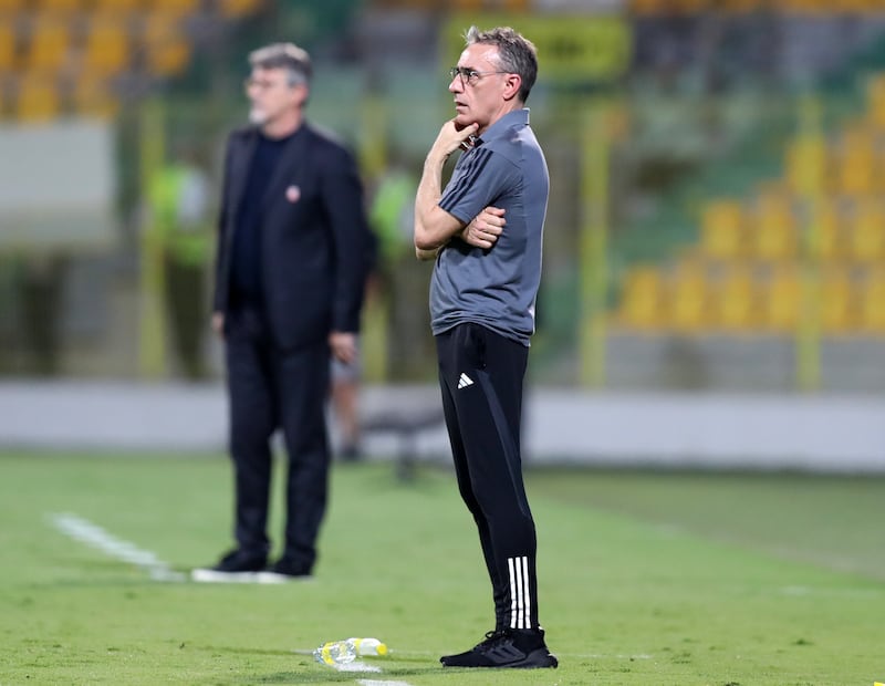 UAE manager Paulo Bento watches the match from the touchline.