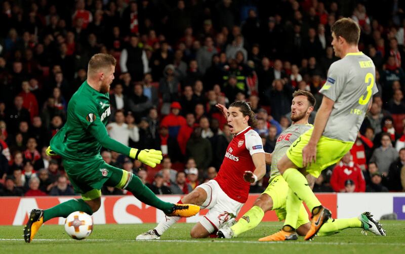 Arsenal's Hector Bellerin scores his team's third goal. John Sibley / Reuters