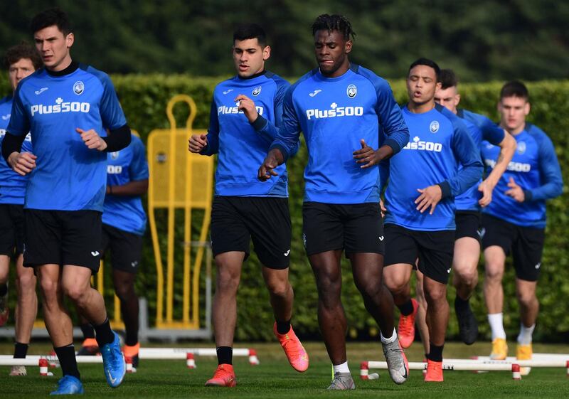 Atalanta's Cristian Romero, Duvan Zapata, Luis Muriel with teammates during training ahead of their Uefa Champions League last-16, first-leg match against Real Madrid. AFP