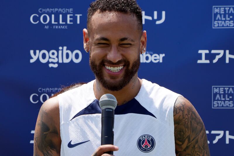 Paris Saint-Germain's Neymar answers a question from a child. AP Photo