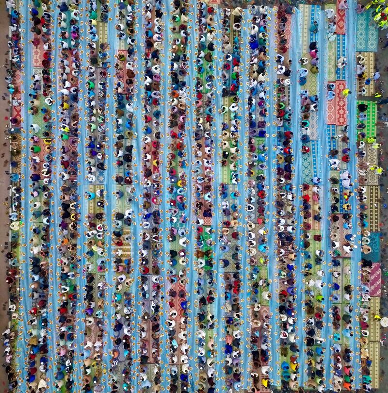 Photo by Dr Ahmad Al Rais - Ramadan brings us together - an abstracted pattern of people taking iftar. Courtesy Manarat Al Saadiyat. 

