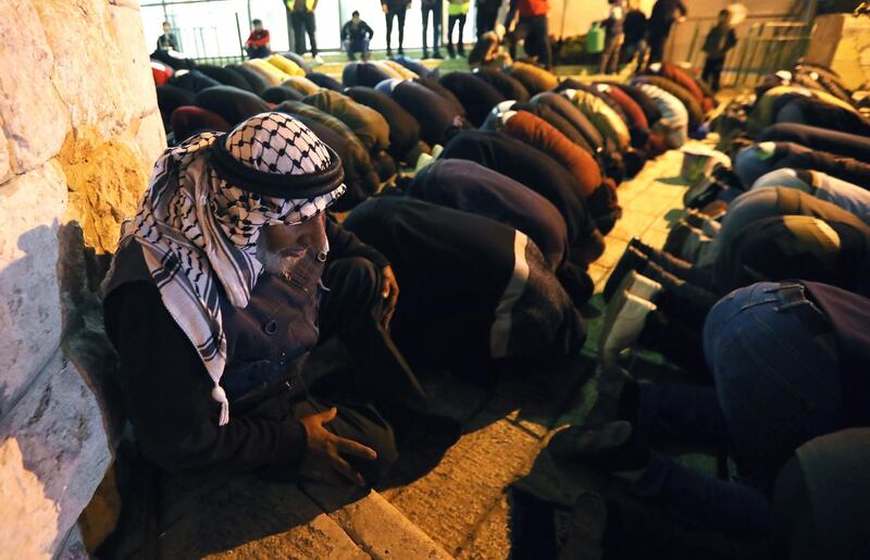 Palestinian Muslim worshippers gather for an early morning prayer service around the Ibrahimi Mosque or the Tomb of the Patriarch in Hebron, West Bank.  EPA