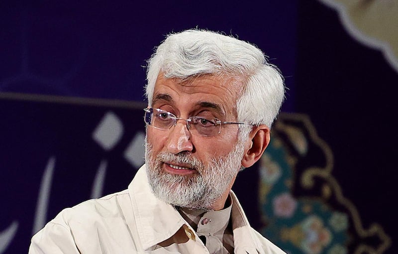 Iran's former top nuclear negotiator and former presidential candidate Saeed Jalili talks to the media after registering his candidacy for the June presidential elections, at the Interior Ministry in the capital Tehran, on May 15, 2021. / AFP / ATTA KENARE
