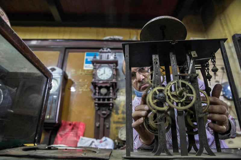 Karam Iskandar, a 56-year-old Egyptian watchmaker, works on a clock at Francis Papazian. AFP