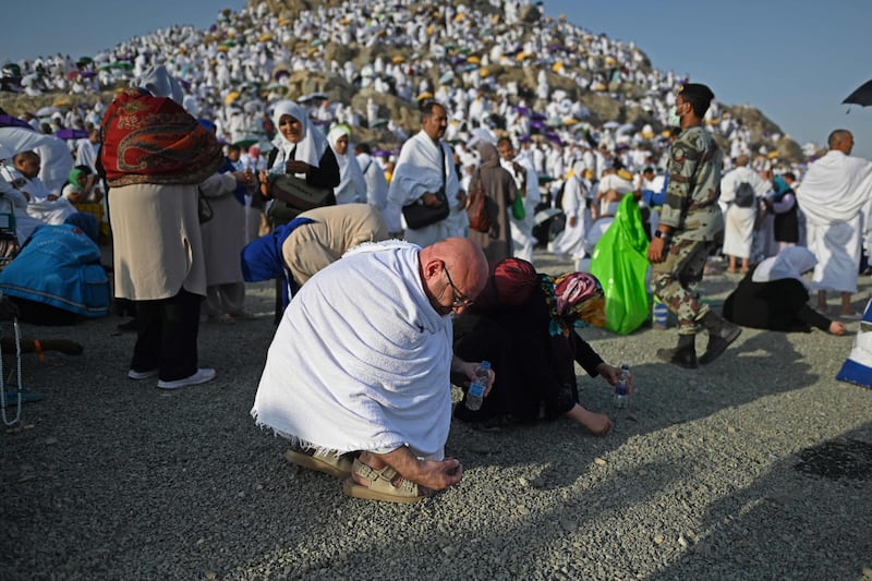 Pilgrims collect pebbles at Mount Arafat. Worshippers are recommended to collect 70 pebbles so they may participate in Jamarat. AFP