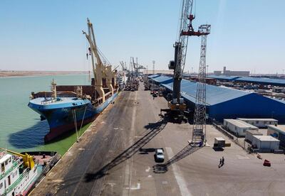 This picture taken on March 14, 2021 shows a view of the Hong Kong-flagged cargo vessel Zea Servant while moored at the port of Umm Qasr, south of Iraq's southern city of Basra. Iraq is ranked the 21st most corrupt country by Transparency International. In January, the advocacy group said public corruption had deprived Iraqis of basic rights and services, including water, health care, electricity and jobs. It said systemic graft was eating away at Iraqis' hopes for the future, pushing growing numbers to try to emigrate. In 2019, hundreds of thousands of protesters flooded Iraqi cities, first railing against poor public services, then explicitly accusing politicians of plundering resources meant for the people. / AFP / Hussein FALEH
