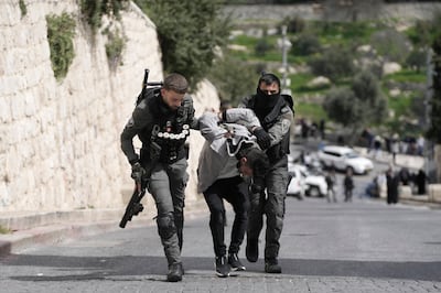 Israeli border police detain a Palestinian man ahead of Friday prayers at Al Aqsa Mosque in the Old City of Jerusalem. AP