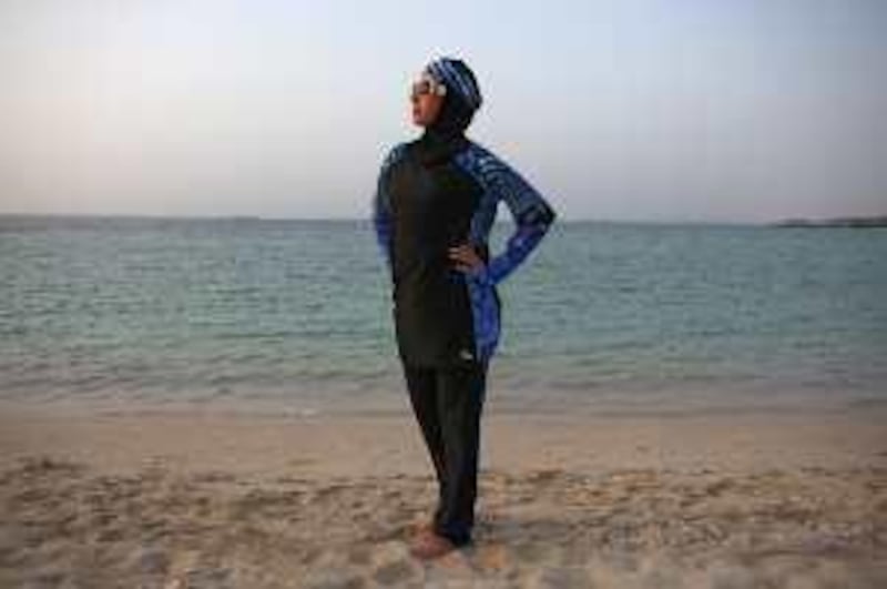 United Arab Emirates -Dubai- Aug. 14, 2009:

WEEKENDER: An Emirati Palestinian (Desk, she did not want to be identified) woman poses for her portrait in a burkini from the Jenny Rose Maternity Store at the Jumeirah Public Beach in Dubai on Friday, Aug. 14, 2009. Amy Leang/The National
 *** Local Caption ***  amy_081409_burkini_03.jpg