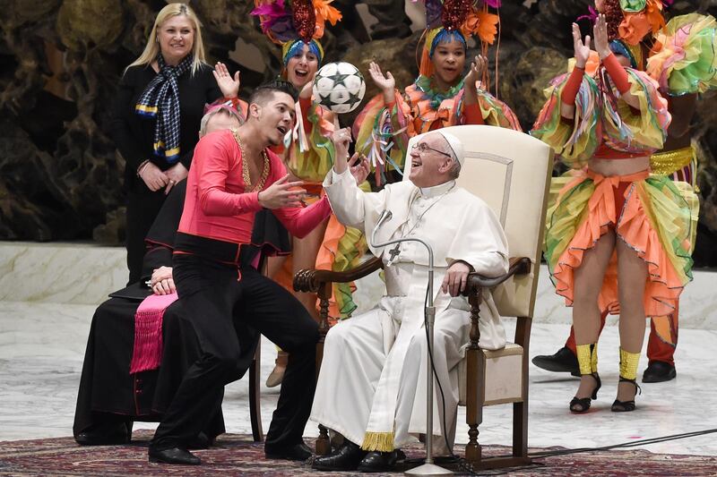 Pope Francis juggles with a ball during weekly general audience in Paul VI hall at The Vatican. AFP
