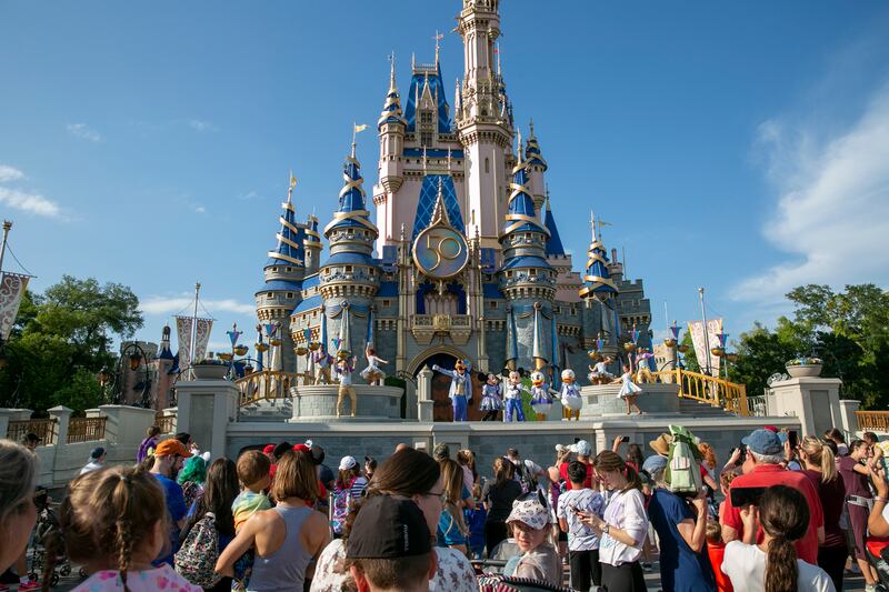 Performers entertain visitors at Walt Disney World Resort in Lake Buena Vista, Florida. AP