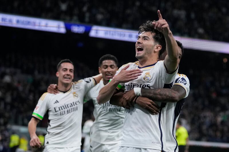 Real Madrid's Brahim Diaz, second from right, celebrates with teammates after scoring the opening goal during the Spanish La Liga soccer match between Real Madrid and Atletico Madrid at the Santiago Bernabeu stadium in Madrid, Spain, Sunday, Feb.  4, 2024.  (AP Photo / Bernat Armangue)