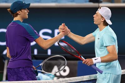 Canada's Denis Shapovalov (R) is congratulated by Italy's Jannik Sinner after their men's singles match on day one of the Australian Open tennis tournament in Melbourne on February 8, 2021. -- IMAGE RESTRICTED TO EDITORIAL USE - STRICTLY NO COMMERCIAL USE --
 / AFP / David Gray / -- IMAGE RESTRICTED TO EDITORIAL USE - STRICTLY NO COMMERCIAL USE --
