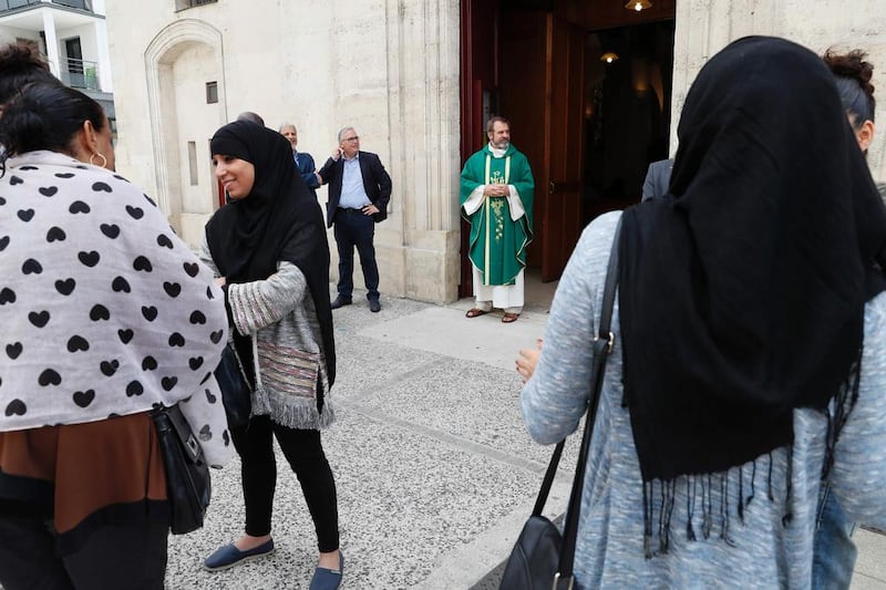 Christian and Muslim worshippers attend a mass in tribute to Father Jacques Hamel. Thomas Samson / AFP