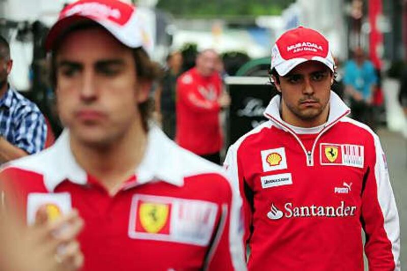 Felipe Massa, right, is at the centre of a 'team order' row involving Fernando Alonso, left, his Ferrari teammate, after he was ordered to move aside for the Spaniard during last weekend's German Grand Prix.