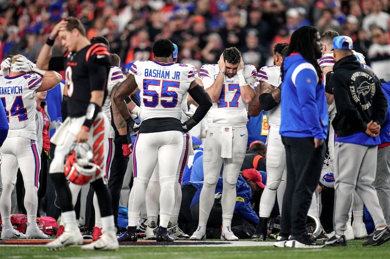 Buffalo Bills players and staff gather as an ambulance parks on the field while CPR is administered to Buffalo Bills safety Damar Hamlin at Paycor Stadium in Downtown Cincinnati on January 2, 2023. USA Today