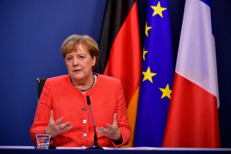 epa08557776 German Chancellor Angela Merkel speaks during a joint video press conference with French President Emmanuel Macron at the end of the European Council in Brussels, Belgium, 21 July 2020. European Union nations leaders agreed on a budget and a recovery mechanism after meeting face-to-face for a fourth day to discuss plans  to respond to the coronavirus pandemic and a new long-term EU budget.  EPA/JOHN THYS / POOL