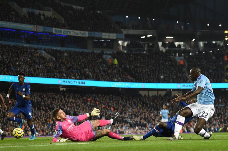 Chelsea's French midfielder N'Golo Kante shoots past Manchester City's Brazilian goalkeeper Ederson. AFP