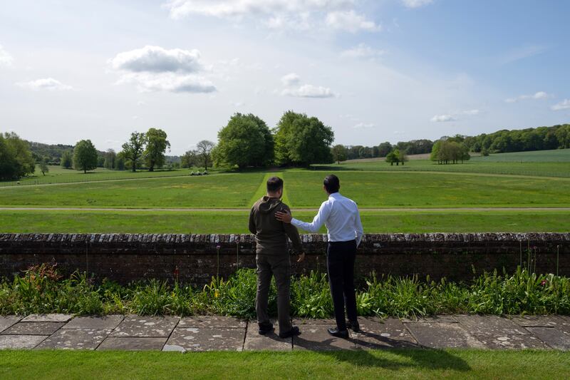 Mr Sunak and Mr Zelenskyy look out towards trees planted by Winston Churchill as they walk in the garden at Chequers. Getty Images
